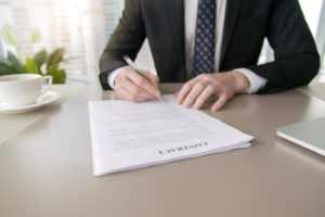 businessman signing contract